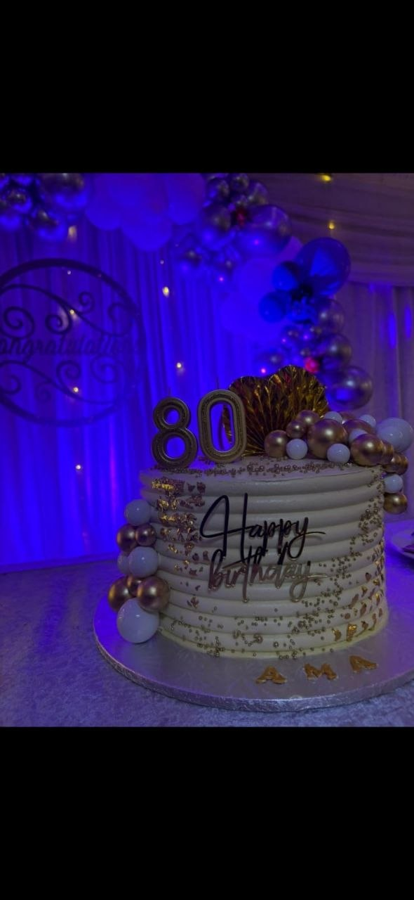 Purple celebration cake with gold accents